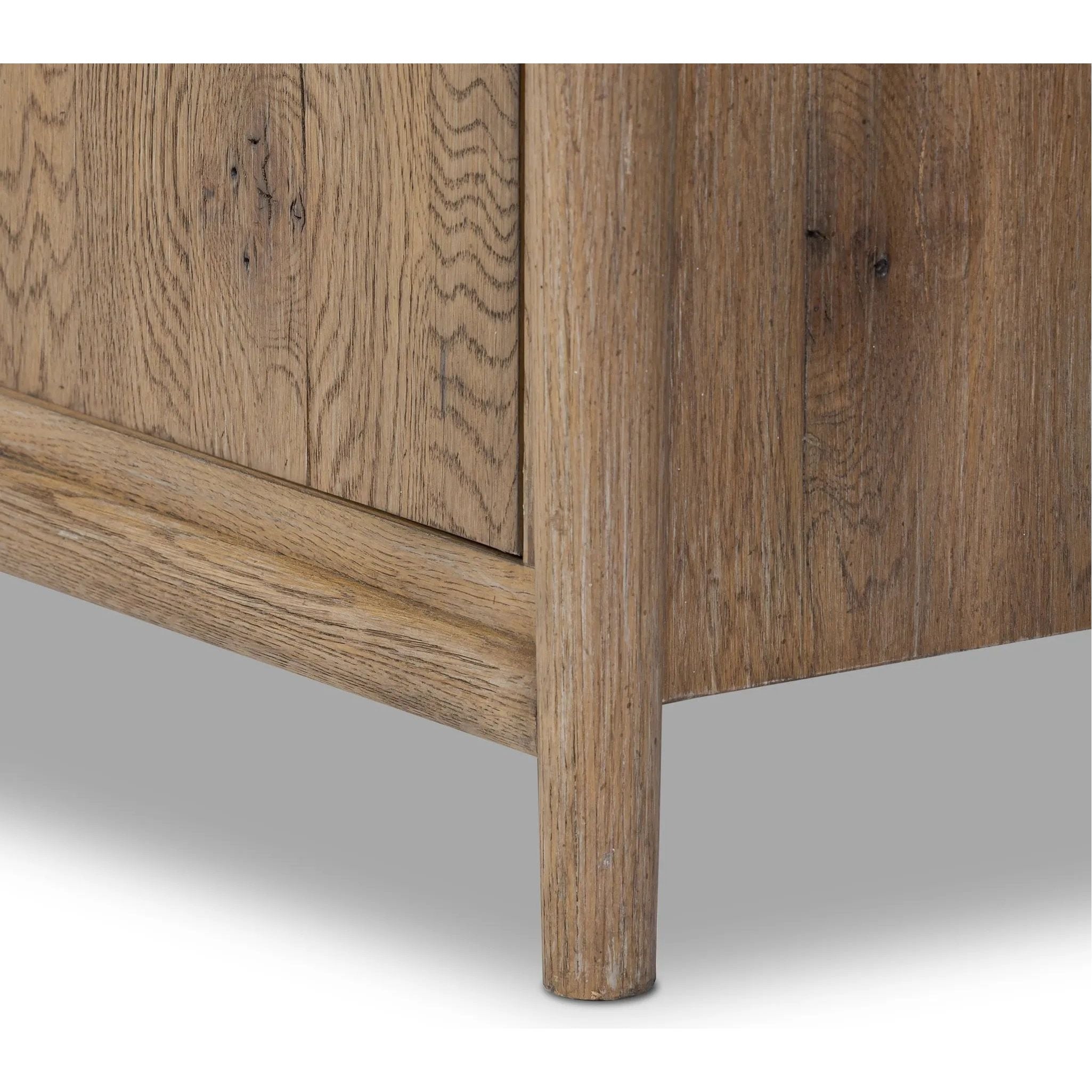 The traditional spindle structure brought to modern speed. Made from weathered oak, the sideboard brings generous storage space to dining and entertaining, working into a range of spaces and collections with ease. Simple cylindrical hardware is finished in an aged bronze Amethyst Home provides interior design, new home construction design consulting, vintage area rugs, and lighting in the Tampa metro area.