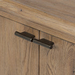 The traditional spindle structure brought to modern speed. Made from weathered oak, the sideboard brings generous storage space to dining and entertaining, working into a range of spaces and collections with ease. Simple cylindrical hardware is finished in an aged bronze Amethyst Home provides interior design, new home construction design consulting, vintage area rugs, and lighting in the Winter Garden metro area.