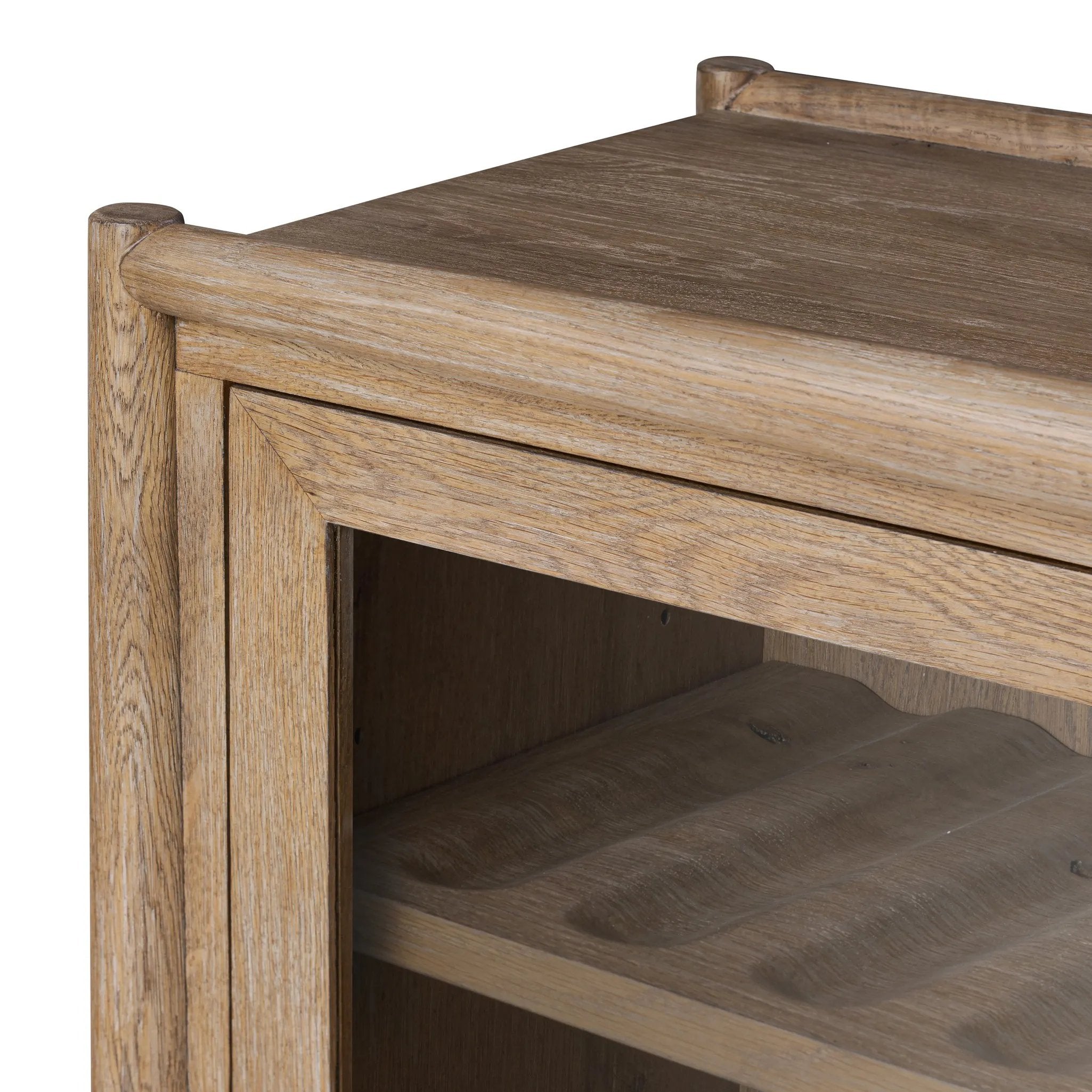 A rustic oak bar cabinet shapes subtly curved corners, bringing a handcrafted look to a minimalist form. Fixed center shelves, functional drawers and glass fronts for open display. Simple hardware is finished in an aged bronze Amethyst Home provides interior design, new home construction design consulting, vintage area rugs, and lighting in the San Diego metro area.