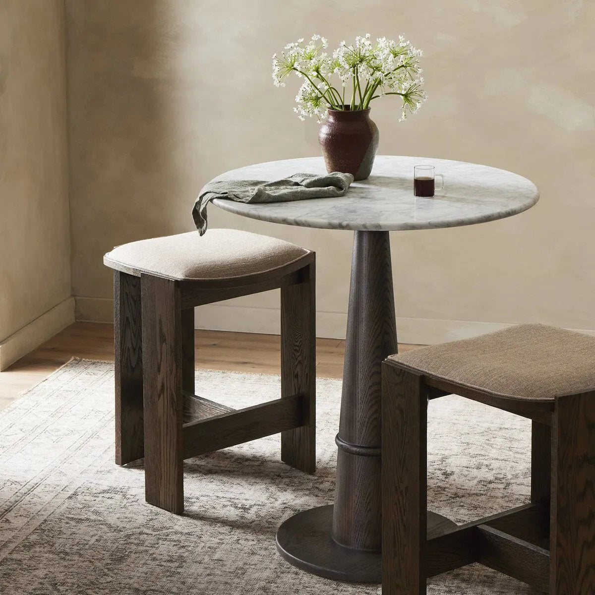 For this fresh take on traditional tulip shaping, a solid oak base pairs with a solid marble tabletop.  Perfectly sized for the bar.Collection: Allsto Amethyst Home provides interior design, new home construction design consulting, vintage area rugs, and lighting in the Park City metro area.
