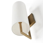 Featuring a single, elongated linen shade, this sconce gracefully diffuses light and is mounted on a streamlined aged brass frame for a sleek, contemporary look.Collection: Camde Amethyst Home provides interior design, new home construction design consulting, vintage area rugs, and lighting in the Dallas metro area.
