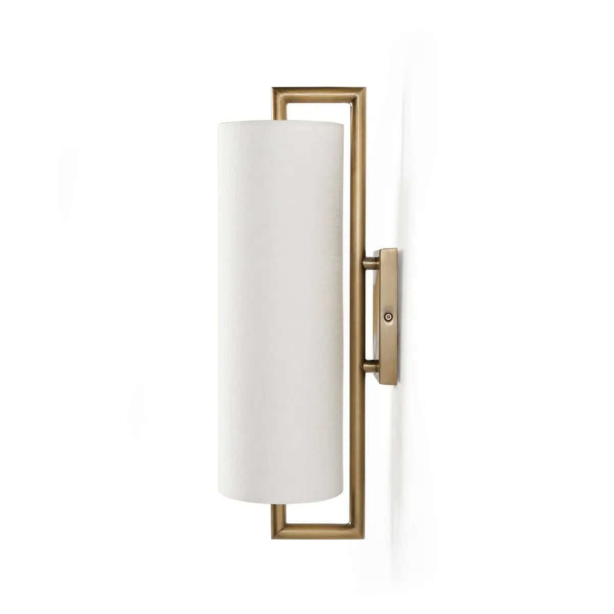 Featuring a single, elongated linen shade, this sconce gracefully diffuses light and is mounted on a streamlined aged brass frame for a sleek, contemporary look.Collection: Camde Amethyst Home provides interior design, new home construction design consulting, vintage area rugs, and lighting in the Newport Beach metro area.