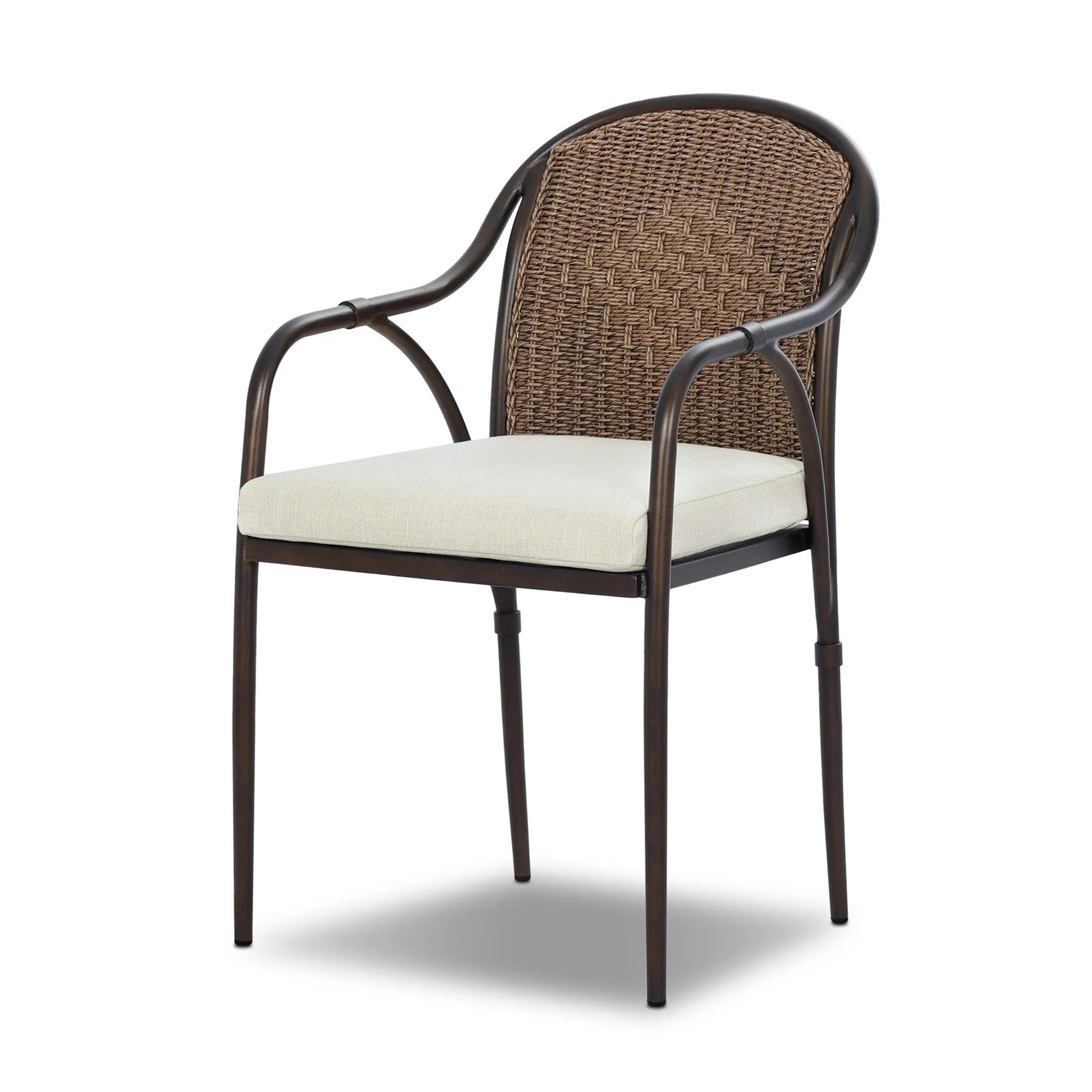 This outdoor dining chair takes inspiration from classic French bistro-style chairs, featuring a distinctive metal collar detail on the arms. The woven seatback comes together in a diamond pattern, finished with a cream-colored seat cushion. Cover or store inside during inclement weather and when not in use. Amethyst Home provides interior design, new home construction design consulting, vintage area rugs, and lighting in the Tampa metro area.