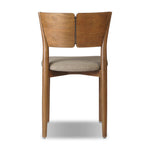 Bring a mixed material moment to your dining space with a Scandinavian-inspired seating style. Solid parawood forms a beautifully curved frame for a slim-profile seat upholstered in taupe high-performance fabric. On the back panel, a thin iron inlay elevates the look with a detail-driven finishing touch. Amethyst Home provides interior design, new home construction design consulting, vintage area rugs, and lighting in the Park City metro area.