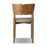 Bring a mixed material moment to your dining space with a Scandinavian-inspired seating style. Solid parawood forms a beautifully curved frame for a slim-profile seat upholstered in taupe high-performance fabric. On the back panel, a thin iron inlay elevates the look with a detail-driven finishing touch. Amethyst Home provides interior design, new home construction design consulting, vintage area rugs, and lighting in the Park City metro area.