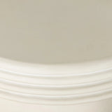 Statuesque and streamlined, an outdoor end table is crafted of smooth solid concrete and detailed with ribbed edging on top. Cover or store indoors during inclement weather and when not in use.As enthusiasts of wabi sabi design at Amethyst, we love the warm modern inspired Grecia Outdoor End Table. Amethyst Home provides interior design, new home construction design consulting, vintage area rugs, and lighting in the Boston metro area.