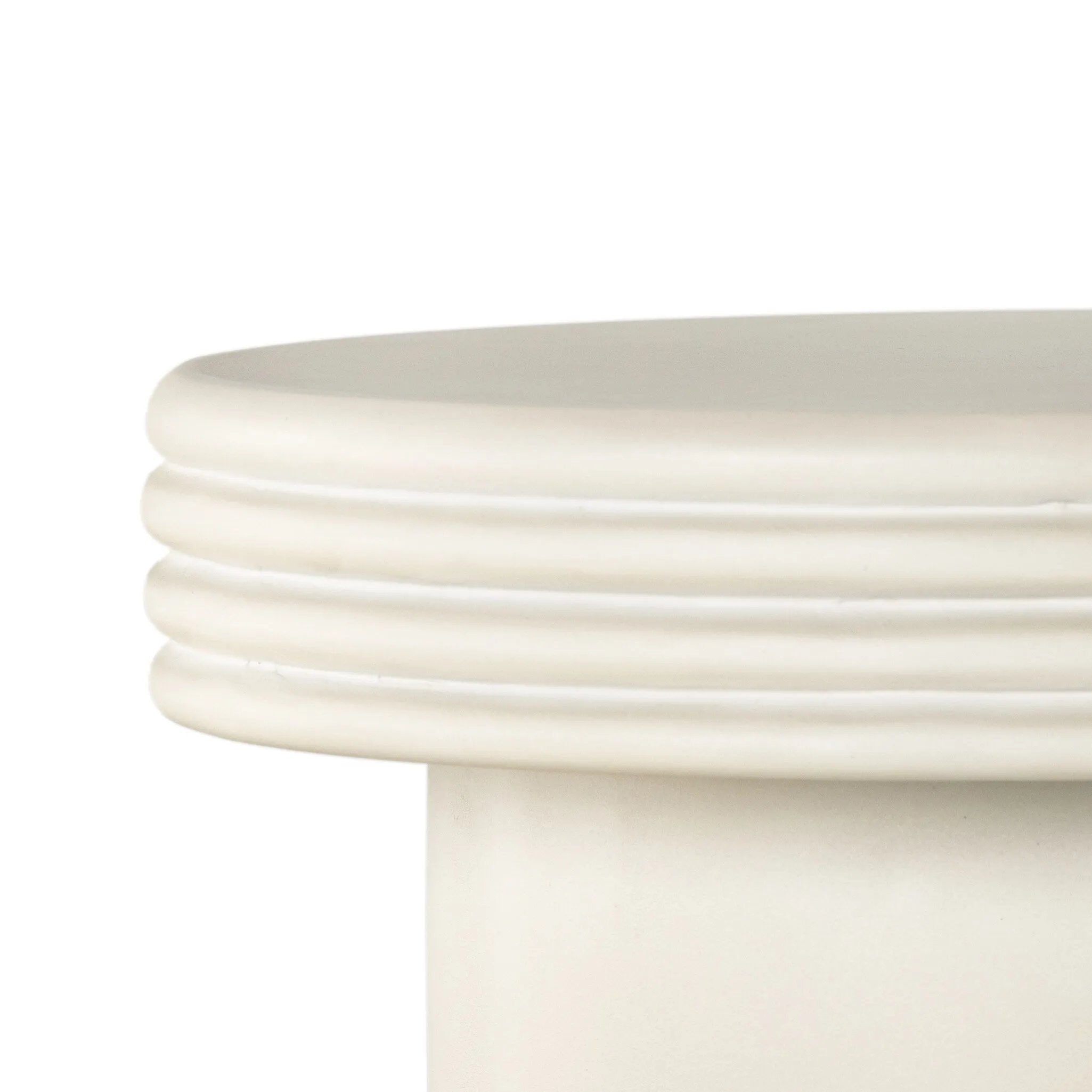 Statuesque and streamlined, an outdoor end table is crafted of smooth solid concrete and detailed with ribbed edging on top. Cover or store indoors during inclement weather and when not in use.As enthusiasts of wabi sabi design at Amethyst, we love the warm modern inspired Grecia Outdoor End Table. Amethyst Home provides interior design, new home construction design consulting, vintage area rugs, and lighting in the Houston metro area.