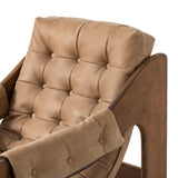 Featuring Halston Palermo Drift Chair by Four Hands at Amethyst Home. Dramatically tufted and angled for comfort, this Seventies-inspired sling seat is made from thick-cut top-grain leather in an earthy taupe, with wide brown ash framing. A plump, pronounced grain accentuates leather's natural markings for a supple, lived-in look.Overall Dimensions: 30.00". Amethyst Home provides interior design, new home construction design consulting, vintage area rugs, and lighting in the Alpharetta metro area.