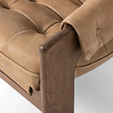 Featuring Halston Palermo Drift Chair by Four Hands at Amethyst Home. Dramatically tufted and angled for comfort, this Seventies-inspired sling seat is made from thick-cut top-grain leather in an earthy taupe, with wide brown ash framing. A plump, pronounced grain accentuates leather's natural markings for a supple, lived-in look.Overall Dimensions: 30.00"w . Amethyst Home provides interior design, new home construction design consulting, vintage area rugs, and lighting in the Portland metro area.