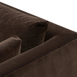 Mid-century modern with a dash of vintage detail, this bench-style sofa makes a statement. With traditional details like turned oak legs and brass casters, this low-profile sofa features an elongated bench seat for an inviting sit. Velvety chocolate-brown upholstery finishes a knife-edge back and boxed arm cushions Amethyst Home provides interior design, new home construction design consulting, vintage area rugs, and lighting in the Dallas metro area.