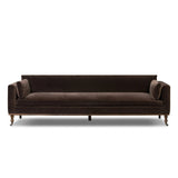 Mid-century modern with a dash of vintage detail, this bench-style sofa makes a statement. With traditional details like turned oak legs and brass casters, this low-profile sofa features an elongated bench seat for an inviting sit. Velvety chocolate-brown upholstery finishes a knife-edge back and boxed arm cushions Amethyst Home provides interior design, new home construction design consulting, vintage area rugs, and lighting in the Omaha metro area.