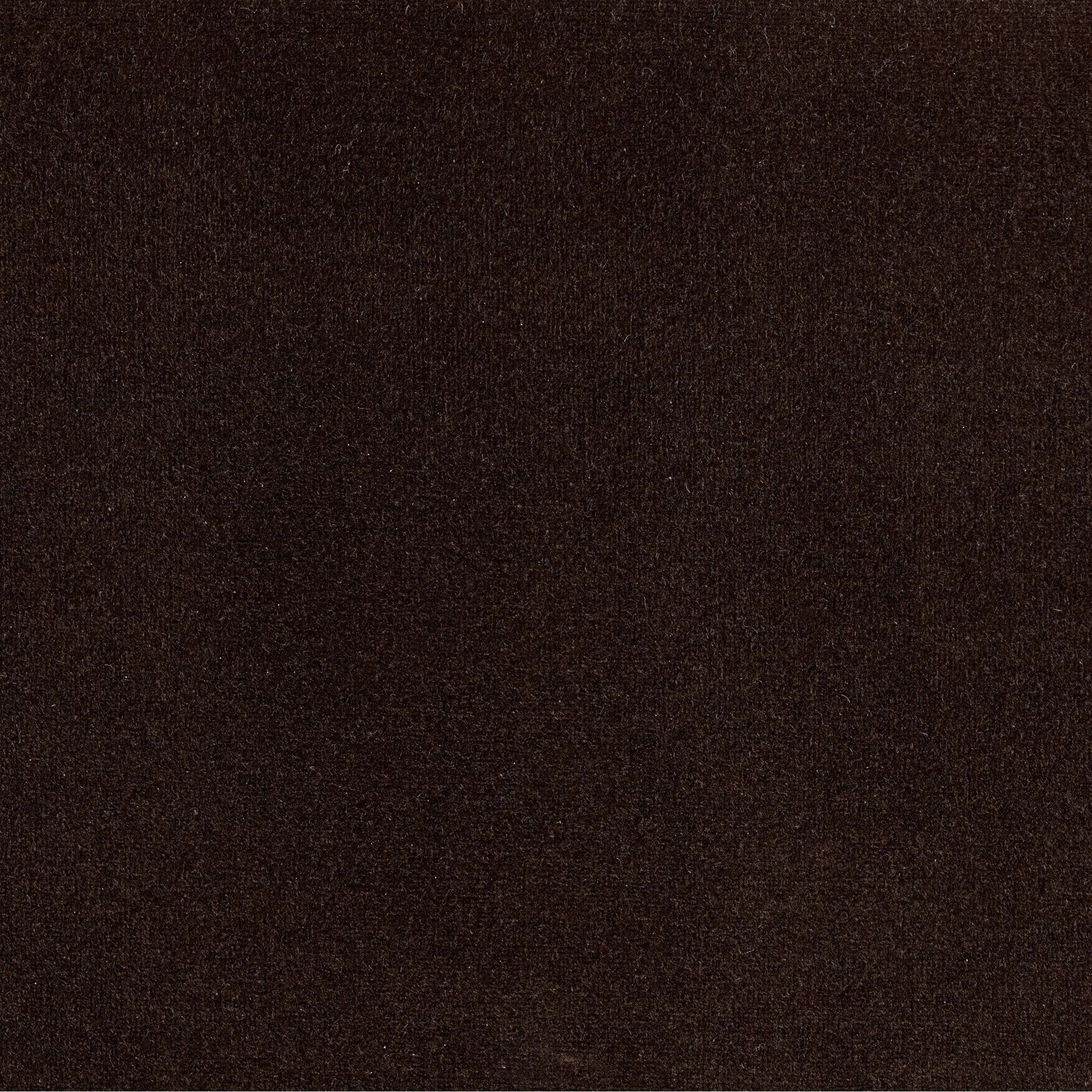 Mid-century modern with a dash of vintage detail, this bench-style sofa makes a statement. With traditional details like turned oak legs and brass casters, this low-profile sofa features an elongated bench seat for an inviting sit. Velvety chocolate-brown upholstery finishes a knife-edge back and boxed arm cushions Amethyst Home provides interior design, new home construction design consulting, vintage area rugs, and lighting in the Scottsdale metro area.