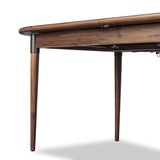 Design with flexibility. Finished in a warm toasted walnut, an oval acacia tabletop, cone-tapered legs and iron detailing speak to Scandinavian modernism. Expansion from 84" to 104" means more space when company calls Amethyst Home provides interior design, new home construction design consulting, vintage area rugs, and lighting in the Des Moines metro area.