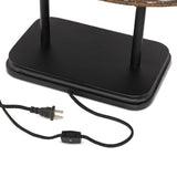 Featuring Harwick Jet Black Table Lamp by Four Hands at Amethyst Home. Craft a warm vibe in any space with a texture-driven table lamp of brown-finished rattan. Black iron shapes a double-arm base with traditional ogee-edge detailing, while a pill-shaped woven shade lets light through to set just the right mood.Overall Dimensions: 20.00"w x 14.00"d x 19.50. Amethyst Home provides interior design, new home construction design consulting, vintage area rugs, and lighting in the Washington metro area.