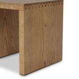 Simple waterfall shaping defined by subtle details. Grain-rich ash offers plenty of movement across the wood, meeting in a prominent scallop cutout detail on each edge for a bold addition of character to this end table. A design collaboration by Amber Lewis and Four Hands. Amethyst Home provides interior design, new home construction design consulting, vintage area rugs, and lighting in the Austin metro area.