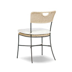 A light, airy take on the traditional bistro shape. This outdoor dining chair features exaggerated splayed legs and a curved X-shaped stretcher, with a handle detail cut out of the woven seat back. Finished with a seat cushion. Cover or store indoors during inclement weather and when not in use Amethyst Home provides interior design, new home construction design consulting, vintage area rugs, and lighting in the Seattle metro area.