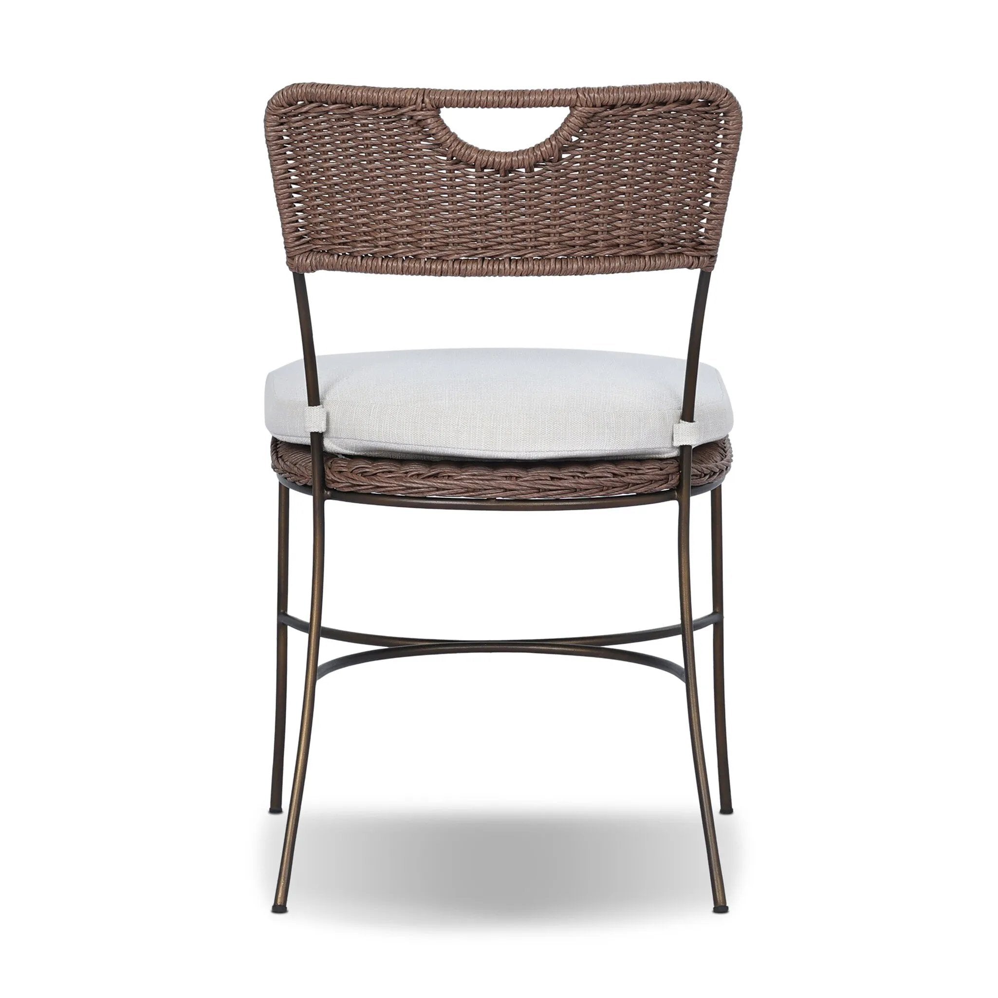 A light, airy take on the traditional bistro shape. This outdoor dining chair features exaggerated splayed legs and a curved X-shaped stretcher, with a handle detail cut out of the woven seat back. Finished with a seat cushion. Cover or store indoors during inclement weather and when not in use. Amethyst Home provides interior design, new home construction design consulting, vintage area rugs, and lighting in the Omaha metro area.