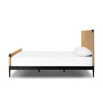 Simple from afar and detailed up close, this organic bed features woven rush for a crafted modern look. A black iron frame offers a striking yet complementary visual contrast.As enthusiasts of luxe style at Amethyst, we love the optimistic inspired Iber Bed. Amethyst Home provides interior design, new home construction design consulting, vintage area rugs, and lighting in the Miami metro area.