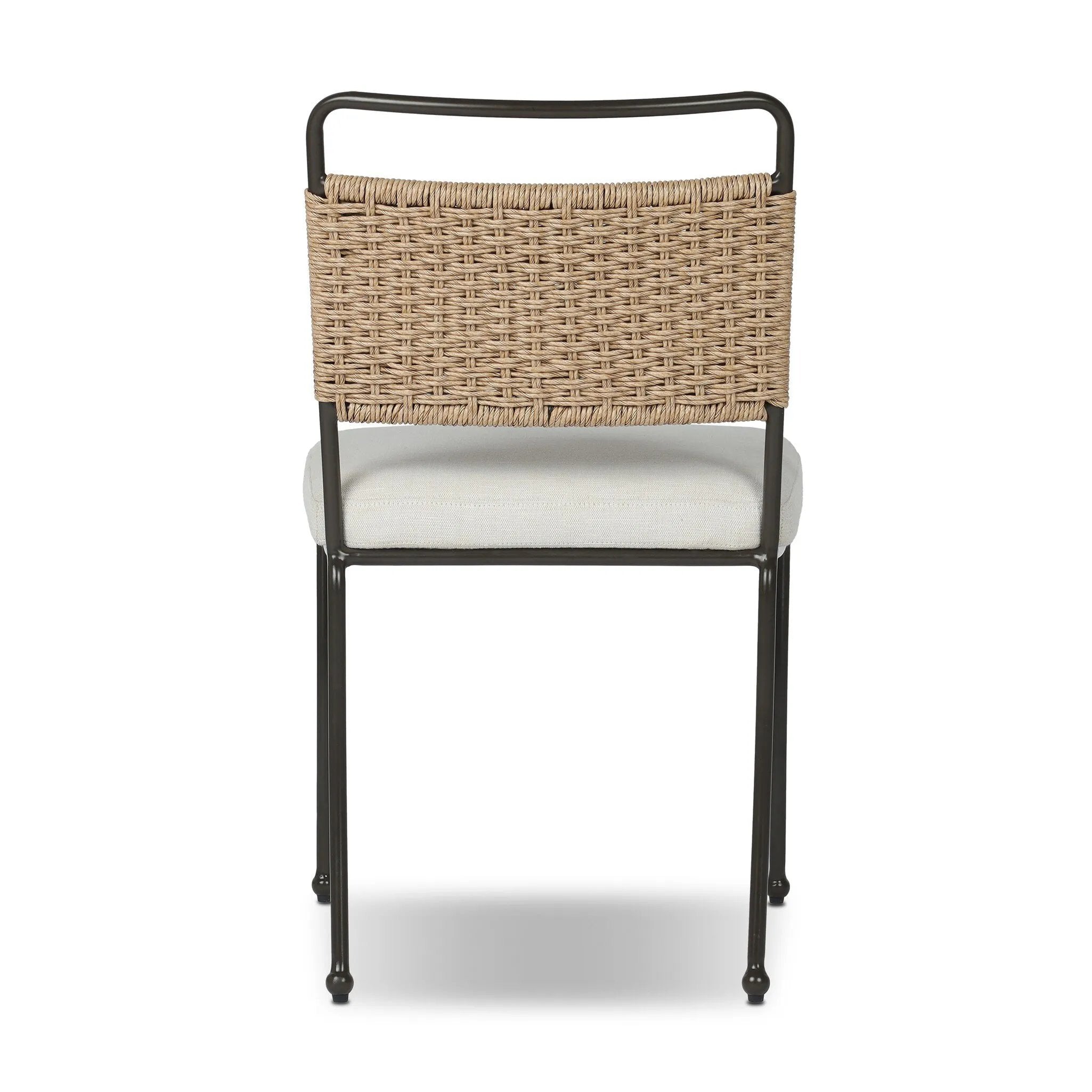 Inspired by Art Deco designs, this outdoor dining chair introduces a sense of movement to a classic silhouette. Subtly curved metal framing, a woven back and upholstered seat cushion craft a thoughtful mix of materials. Cover or store inside during inclement weather and when not in use. Amethyst Home provides interior design, new home construction design consulting, vintage area rugs, and lighting in the San Diego metro area.