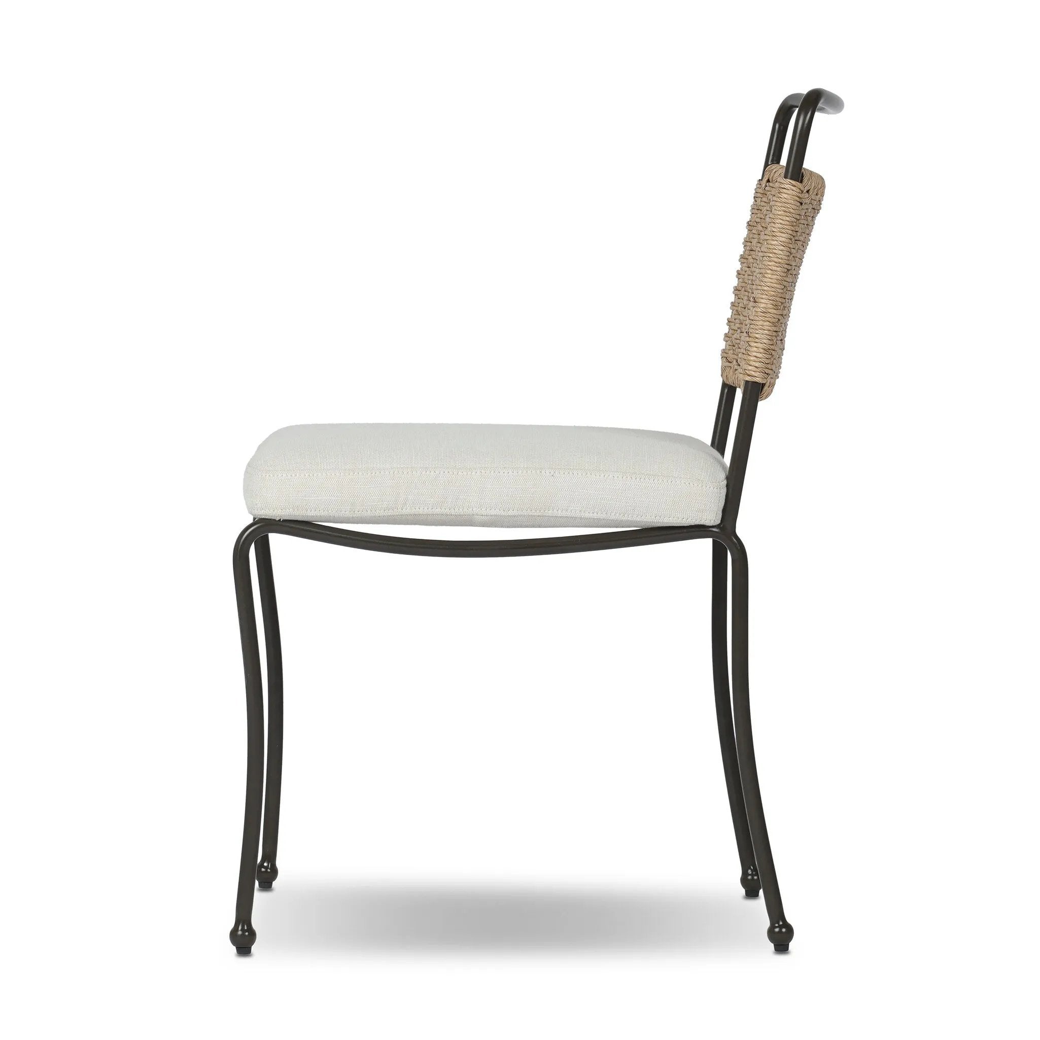 Inspired by Art Deco designs, this outdoor dining chair introduces a sense of movement to a classic silhouette. Subtly curved metal framing, a woven back and upholstered seat cushion craft a thoughtful mix of materials. Cover or store inside during inclement weather and when not in use. Amethyst Home provides interior design, new home construction design consulting, vintage area rugs, and lighting in the Tampa metro area.