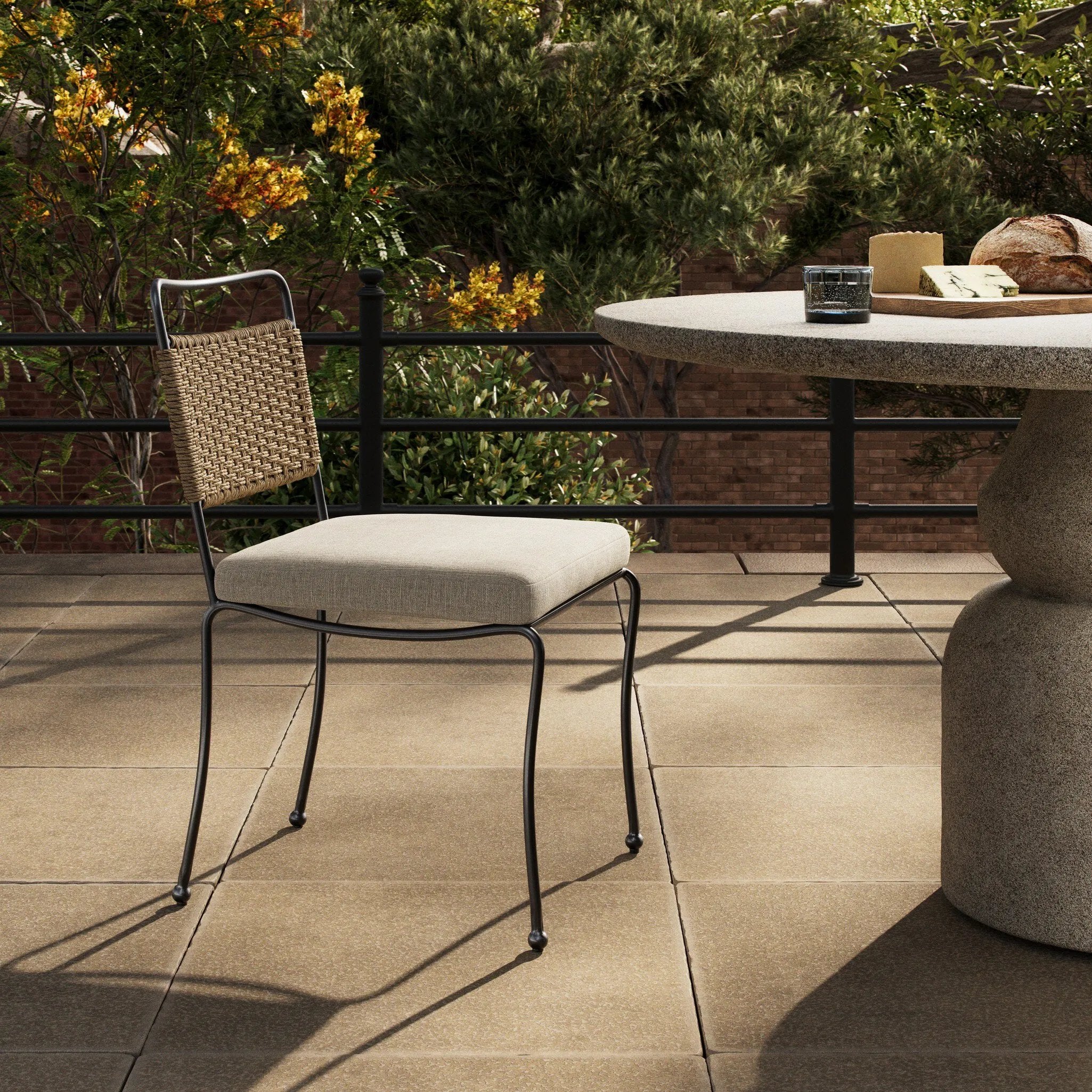 Inspired by Art Deco designs, this outdoor dining chair introduces a sense of movement to a classic silhouette. Subtly curved metal framing, a woven back and upholstered seat cushion craft a thoughtful mix of materials. Cover or store inside during inclement weather and when not in use. Amethyst Home provides interior design, new home construction design consulting, vintage area rugs, and lighting in the Winter Garden metro area.