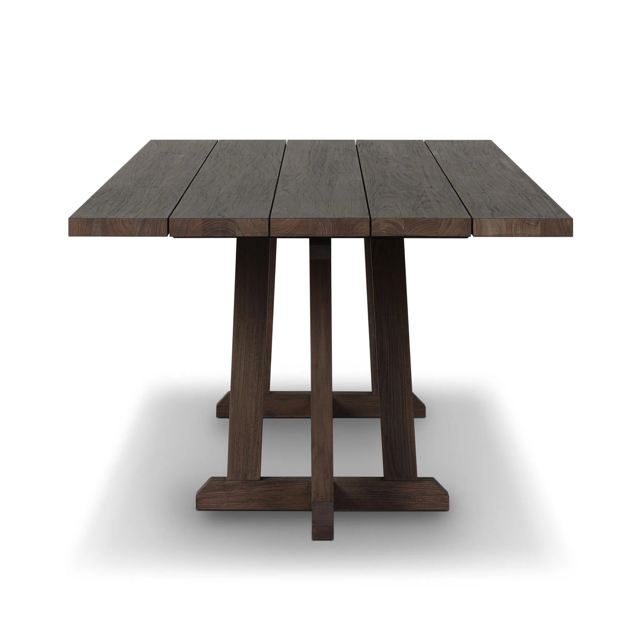 Subtly angled legs meet in a trestle-style stretcher base, pairing with a slatted top for a rustic-style outdoor dining table, also ideal for indoor spaces. Large chamfer details on the base and supports bring softness to FSC®-certified teak. Cover or store inside during inclement weather and when not in use Amethyst Home provides interior design, new home construction design consulting, vintage area rugs, and lighting in the Miami metro area.
