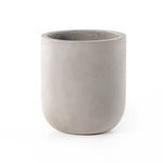 Grey-finished concrete and round shaping make for a naturally sleek planter, indoors or out. Cover or store inside during inclement weather and when not in use Amethyst Home provides interior design, new home construction design consulting, vintage area rugs, and lighting in the Calabasas metro area.