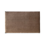 This French Industrialist-inspired cocktail ottoman features a curved stretcher base of bronzed hammered iron and a velvety seat in a versatile earth tone. Style with a sofa or sectional to create an extra surface in your living space, or for bonus seating. Amethyst Home provides interior design, new home construction design consulting, vintage area rugs, and lighting in the Seattle metro area.
