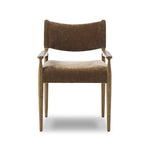 A midcentury-inspired piece brought to modern speed. A supportive, sling-style back and seat cushion are upholstered in a soft, velvety fabric, with toasted oak arms prime for the head of the table Amethyst Home provides interior design, new home construction design consulting, vintage area rugs, and lighting in the Boston metro area.