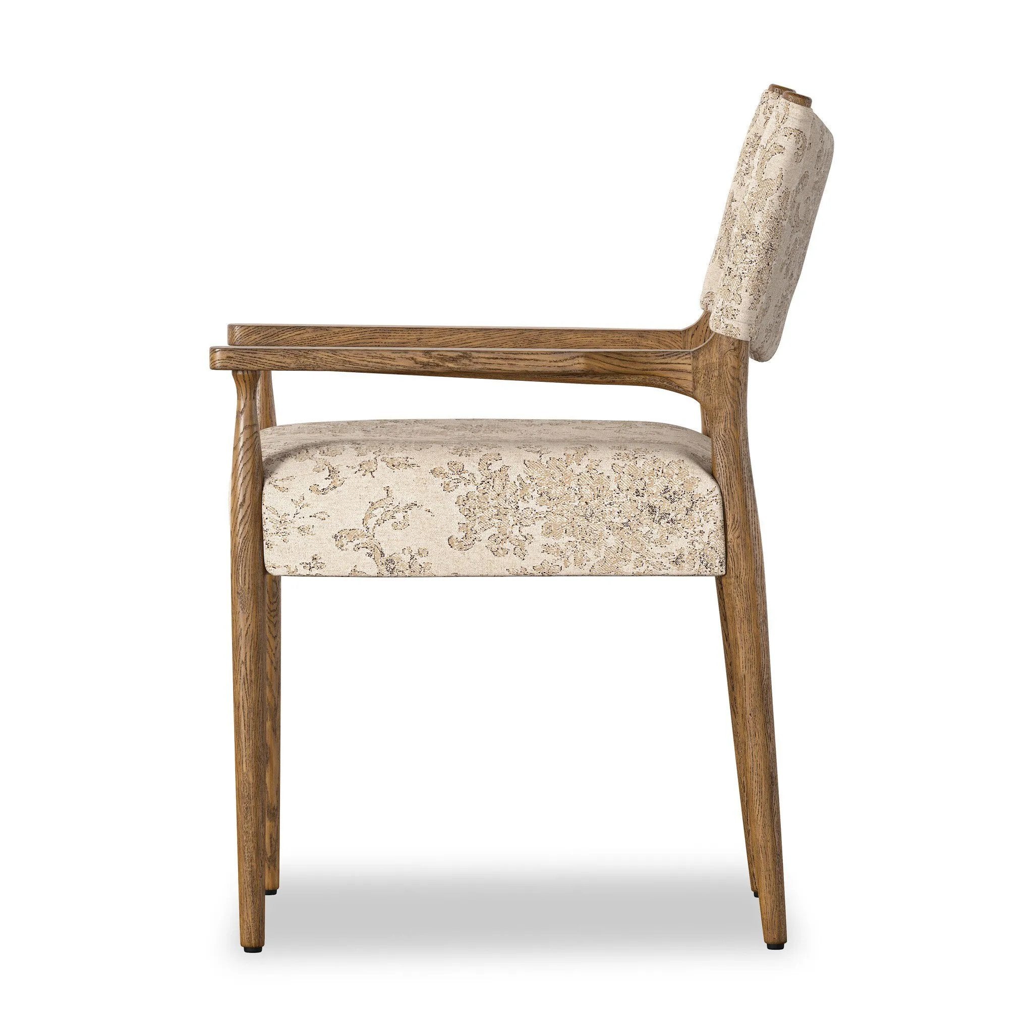 A midcentury-inspired piece brought to modern speed. A supportive, sling-style back and seat cushion are upholstered in a soft, velvety fabric, with toasted oak arms prime for the head of the table Amethyst Home provides interior design, new home construction design consulting, vintage area rugs, and lighting in the Salt Lake City metro area.