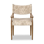 A midcentury-inspired piece brought to modern speed. A supportive, sling-style back and seat cushion are upholstered in a soft, velvety fabric, with toasted oak arms prime for the head of the table Amethyst Home provides interior design, new home construction design consulting, vintage area rugs, and lighting in the San Diego metro area.