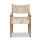 A midcentury-inspired piece brought to modern speed. A supportive, sling-style back and seat cushion are upholstered in a soft, velvety fabric, with toasted oak arms prime for the head of the table Amethyst Home provides interior design, new home construction design consulting, vintage area rugs, and lighting in the San Diego metro area.