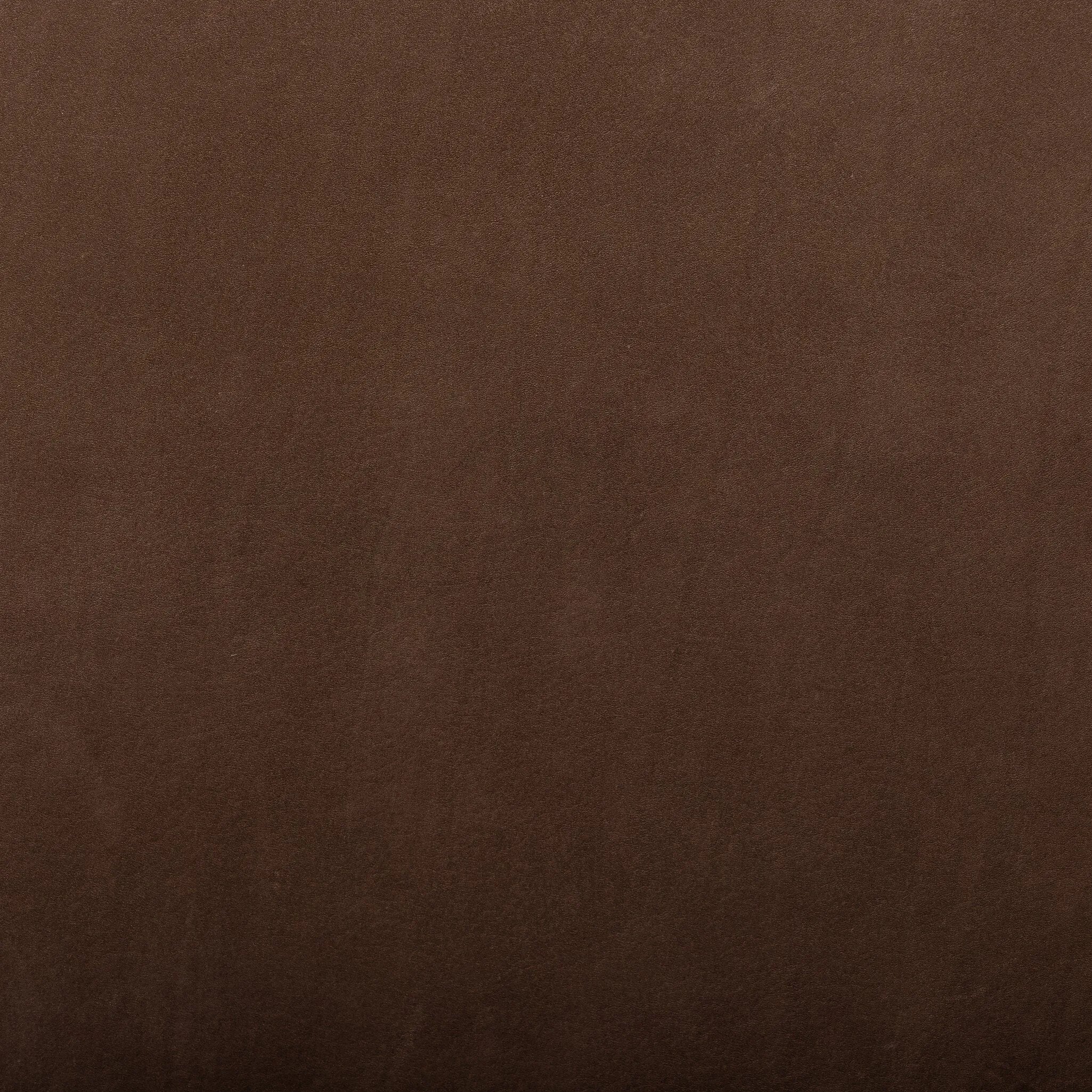 A midcentury-inspired piece brought to modern speed. A supportive, sling-style back and seat cushion are upholstered in a soft, velvety fabric, with toasted oak arms prime for the head of the table Amethyst Home provides interior design, new home construction design consulting, vintage area rugs, and lighting in the Boston metro area.