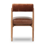 Featuring Jazelle Altair Sienna Dining Chair by Four Hands at Amethyst Home. The armless dining chair gets a playful update with a bolstered cylinder seat back. Made from top-grain leather and warm-finished oak to elevate your bar, kitchen or dining space. Overall Dimensions: 22.25"w x 25.75"d x 32.25"h. Amethyst Home provides interior design, new home construction design consulting, vintage area rugs, and lighting in the Houston metro area.