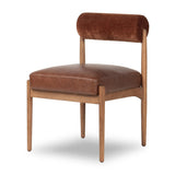 Featuring Jazelle Altair Sienna Dining Chair by Four Hands at Amethyst Home. The armless dining chair gets a playful update with a bolstered cylinder seat back. Made from top-grain leather and warm-finished oak to elevate your bar, kitchen or dining space. Overall Dimensions: 22.25"w x 25.75"d x 32.25"h. Amethyst Home provides interior design, new home construction design consulting, vintage area rugs, and lighting in the San Diego metro area.