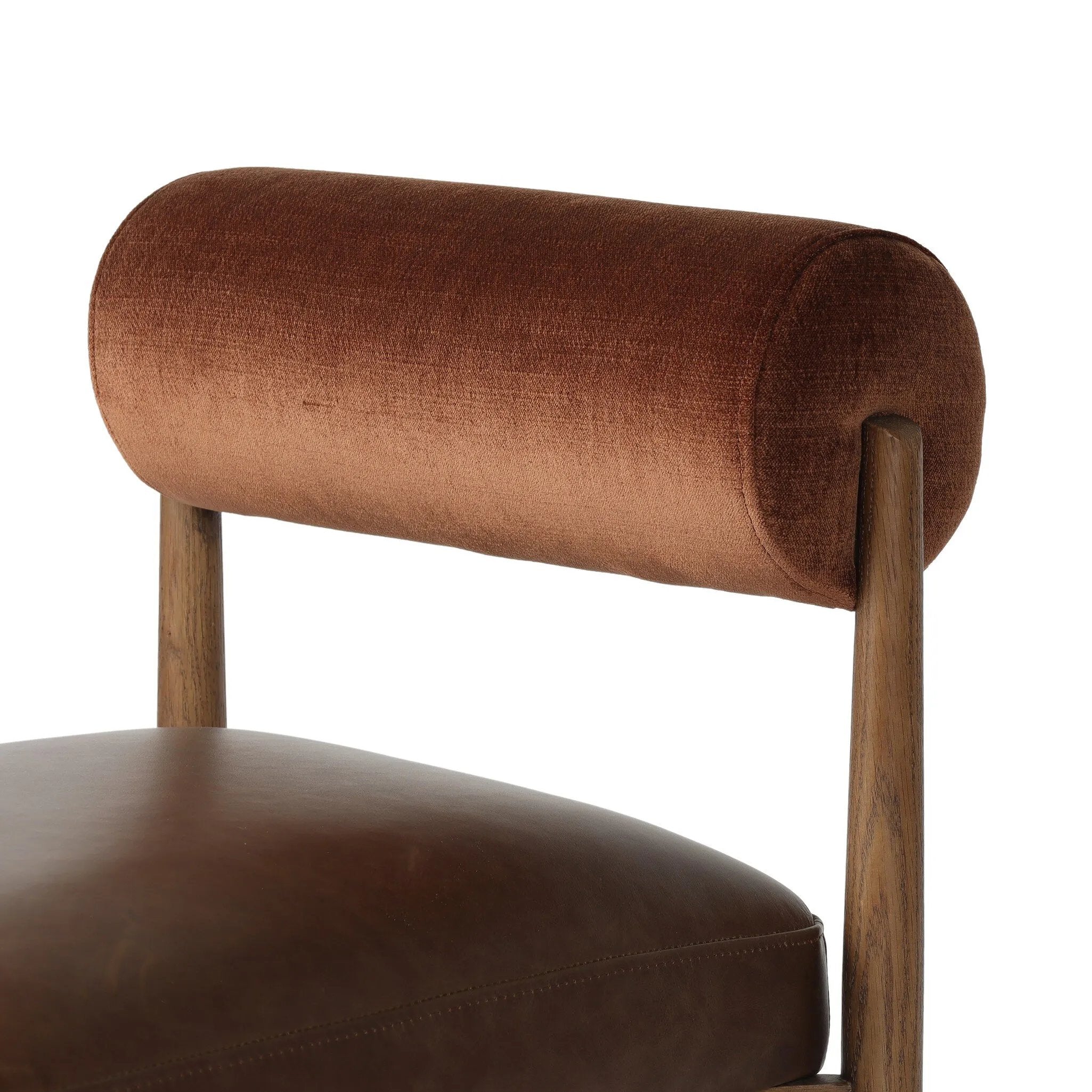 The classic counter stool gets a playful update with a bolstered cylinder seat back. Made from top-grain leather, velvet-like upholstery and warm-finished oak to elevate your bar, kitchen or dining space Amethyst Home provides interior design, new home construction design consulting, vintage area rugs, and lighting in the Austin metro area.