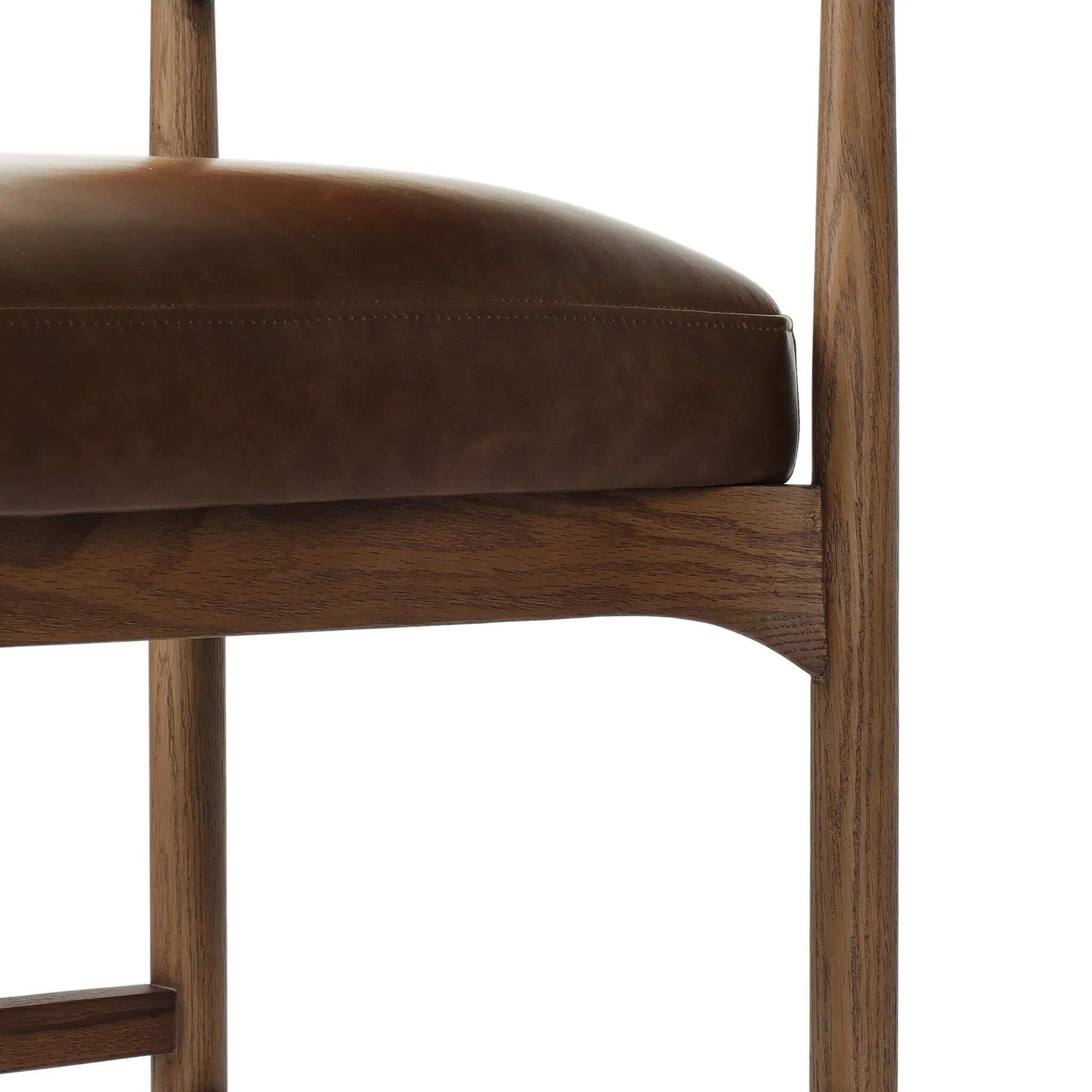 The classic counter stool gets a playful update with a bolstered cylinder seat back. Made from top-grain leather, velvet-like upholstery and warm-finished oak to elevate your bar, kitchen or dining space Amethyst Home provides interior design, new home construction design consulting, vintage area rugs, and lighting in the Scottsdale metro area.