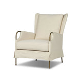 Bridging timeless tradition with modern edge, this upholstered chair strikes a one-of-a-kind silhouette. Its fixed, skirted slipcover and subtle winged back offer a classic feel, while a unique metal arm reveal  and slightly flared legs create an unparalleled look. Amethyst Home provides interior design, new home construction design consulting, vintage area rugs, and lighting in the Boston metro area.