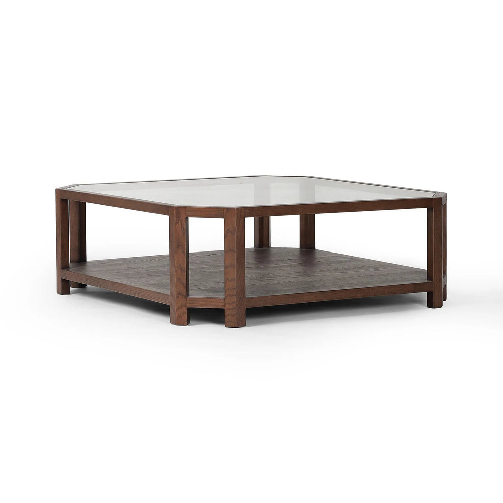 Featuring Jenzen Tempered Glass Coffee Table by Four Hands at Amethyst Home. Mix materials for a timeless look. Warm, brown oak shapes a unique octagon frame for a tempered glass top. Lower open shelving brings bonus storage and display options to your living space. Overall Dimensions: 48.00"w x 48.00"d x 16.50"h. Amethyst Home provides interior design, new home construction design consulting, vintage area rugs, and lighting in the Houston metro area.