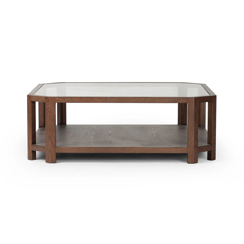 Featuring Jenzen Tempered Glass Coffee Table by Four Hands at Amethyst Home. Mix materials for a timeless look. Warm, brown oak shapes a unique octagon frame for a tempered glass top. Lower open shelving brings bonus storage and display options to your living space. Overall Dimensions: 48.00"w x 48.00"d x 16.50"h. Amethyst Home provides interior design, new home construction design consulting, vintage area rugs, and lighting in the Washington metro area.