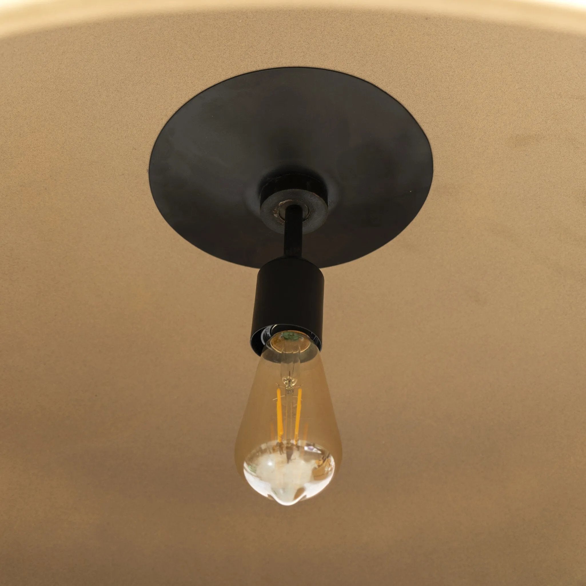 An oversized dome with a speckled glossy finish hangs from overscale chain links for impact. Links are removable to adjust the length Amethyst Home provides interior design, new home construction design consulting, vintage area rugs, and lighting in the Dallas metro area.