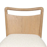 Bring a monochromatic, mixed-material look to the counter. Light solid oak shapes a curved seat back and sturdy frame for comfy seating upholstered with off-white performance fabric. A "handle" opening at the top of the seat back brings a touch of lightness to the look. Amethyst Home provides interior design, new home construction design consulting, vintage area rugs, and lighting in the Winter Garden metro area.