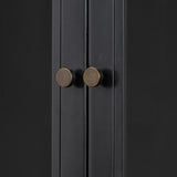 Featuring Jimi Black Cabinet by Four Hands at Amethyst Home. Storage-driven cabinetry inspired by angular geometry. Rich with monochromatic presence, a black-finished metal cabinet pairs with an airy iron base for a balance in scale. Three drawers bring even more storage, with bi-fold glass doors for display options. Minimalist bronzed hardware completes th. Amethyst Home provides interior design, new home construction design consulting, vintage area rugs, and lighting in the San Diego metro area.