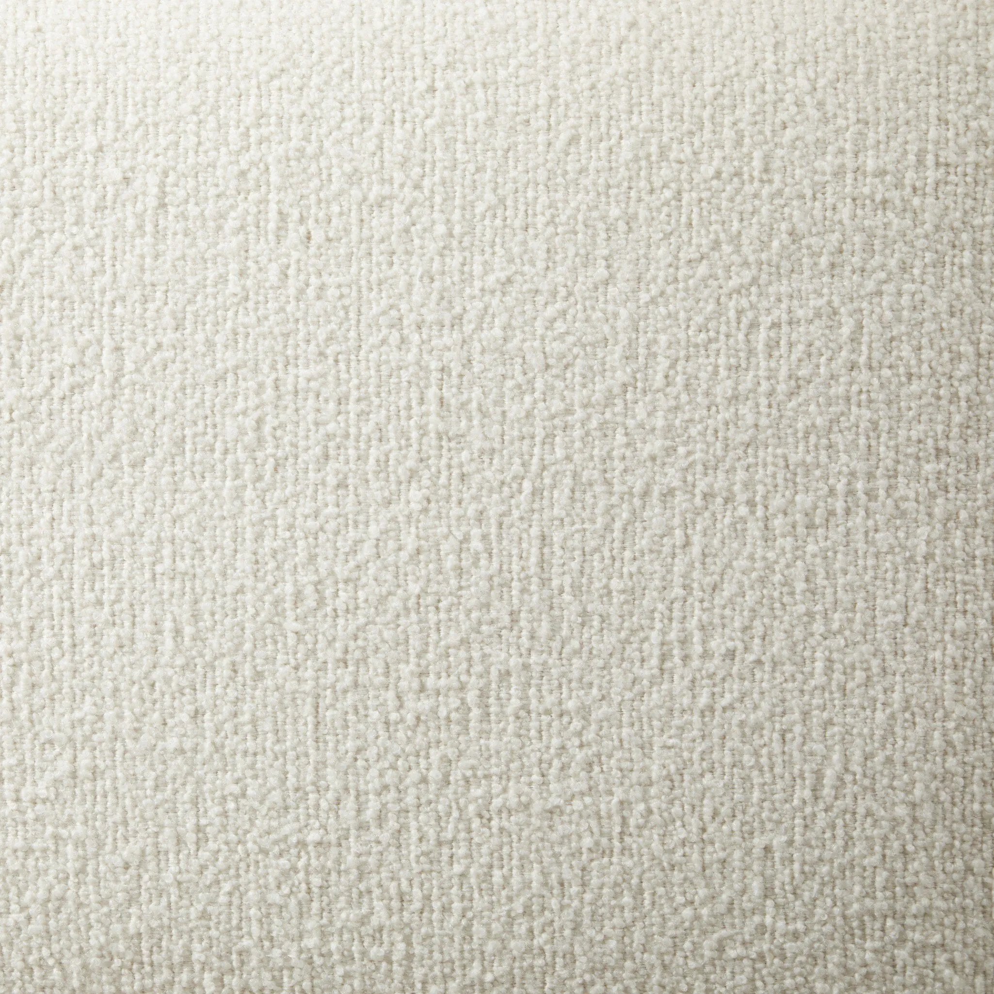 Swooping curves and full upholstery make for an elegant combination. Cream fabric wraps generous cushioning all around, giving textural depth to the bed Amethyst Home provides interior design, new home construction design consulting, vintage area rugs, and lighting in the Dallas metro area.