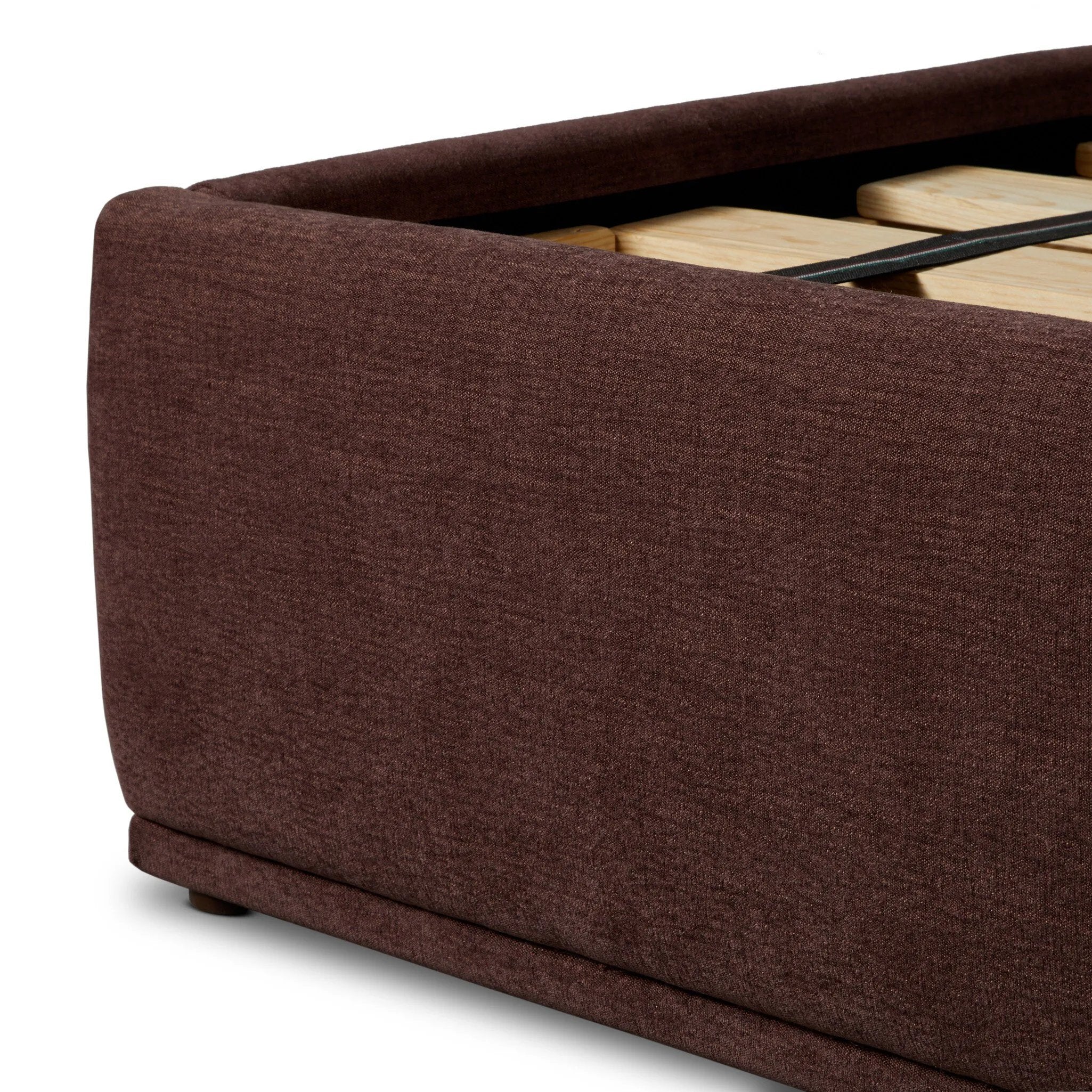 Subtly curved, this swooping bed frame is fully upholstered in a soft, plum-hue fabric for an inviting look that's rich in comfort Amethyst Home provides interior design, new home construction design consulting, vintage area rugs, and lighting in the Portland metro area.