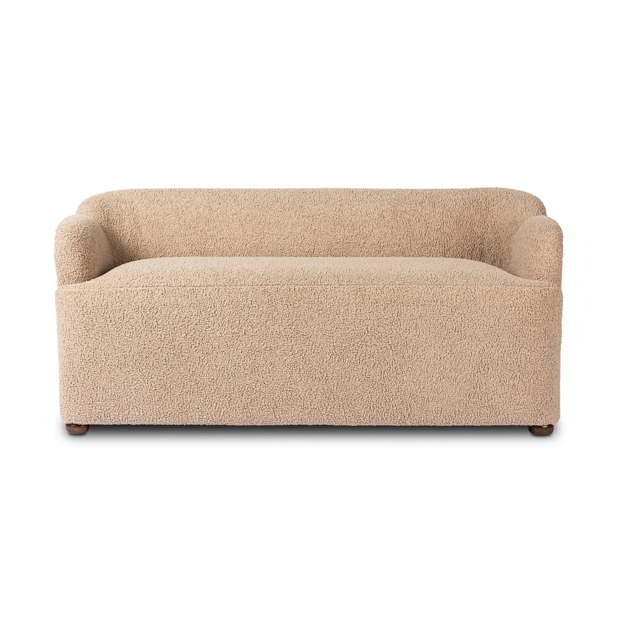 Simply classic. A high wing back pairs with softly rolled arms for a curvy look and supportive sit. Tan shearling-like upholstery invites you to settle in.As fans of natural style at Amethyst, we love the warm modern inspired Kadon Accent Bench - Sheepskin Camel. Amethyst Home provides interior design, new home construction design consulting, vintage area rugs, and lighting in the Charlotte metro area.