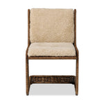 Contours and cantilevers define this Seventies-inspired dining chair. A woven sculptural frame of natural rattan bolsters textural shearling cushions for max comfort.As fans of wabi sabi materials at Amethyst, we love the warm modern inspired Katrine Dining Chair - Beige Shorn Shearling. Amethyst Home provides interior design, new home construction design consulting, vintage area rugs, and lighting in the Houston metro area.