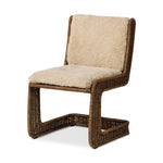 Contours and cantilevers define this Seventies-inspired dining chair. A woven sculptural frame of natural rattan bolsters textural shearling cushions for max comfort.As fans of wabi sabi materials at Amethyst, we love the warm modern inspired Katrine Dining Chair - Beige Shorn Shearling. Amethyst Home provides interior design, new home construction design consulting, vintage area rugs, and lighting in the Washington metro area.