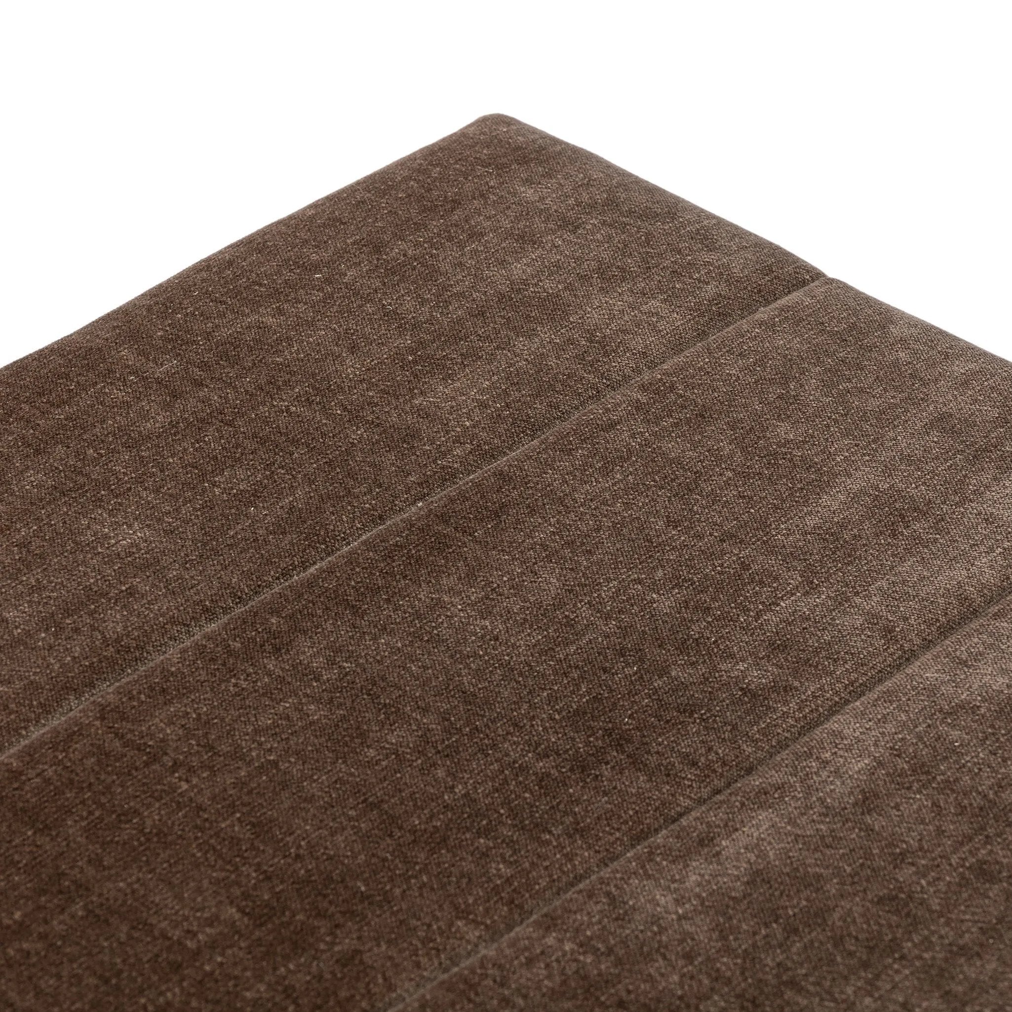 Picture this contemporary yet timeless trunk at the foot of your bed, for storage of extra linens, clothing or throw pillows. This soft, structured piece features a velvety fabric with vertical channel tufting. All grounded by a solid oak base. Amethyst Home provides interior design, new home construction design consulting, vintage area rugs, and lighting in the Park City metro area.