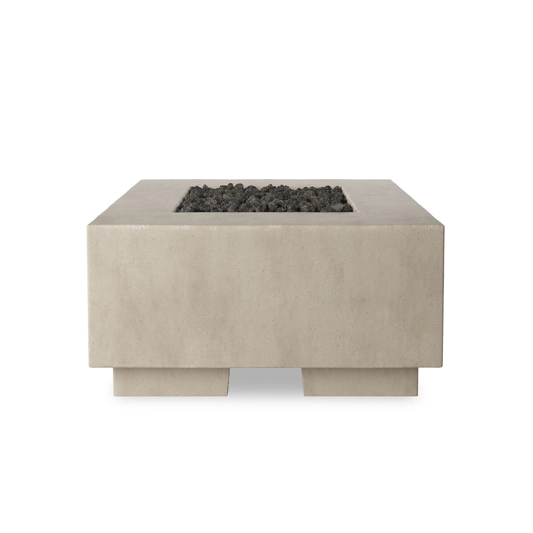 This outdoor fire table is a welcoming centerpiece designed for gathering. Made from glass-reinforced concrete, each piece is naturally finished with deep tones of pewter and dark grey. The monolithic shape is completed with lavastones in the center, bringing together a bold, monochromatic look. Amethyst Home provides interior design, new home construction design consulting, vintage area rugs, and lighting in the Scottsdale metro area.